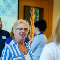 An alumni enjoying conversation at the Laker Legacy Brunch